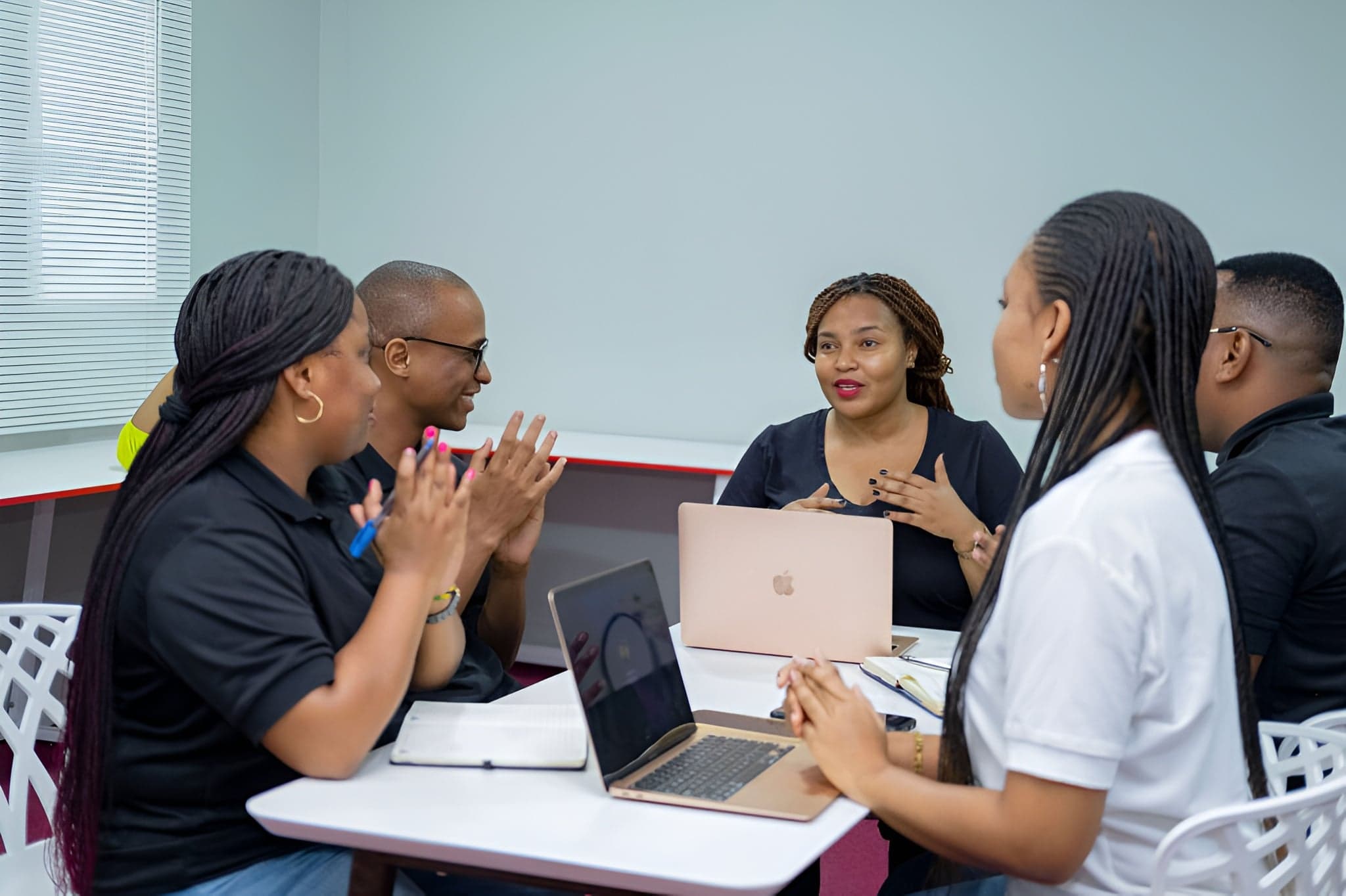 Gwen Global team in a meeting