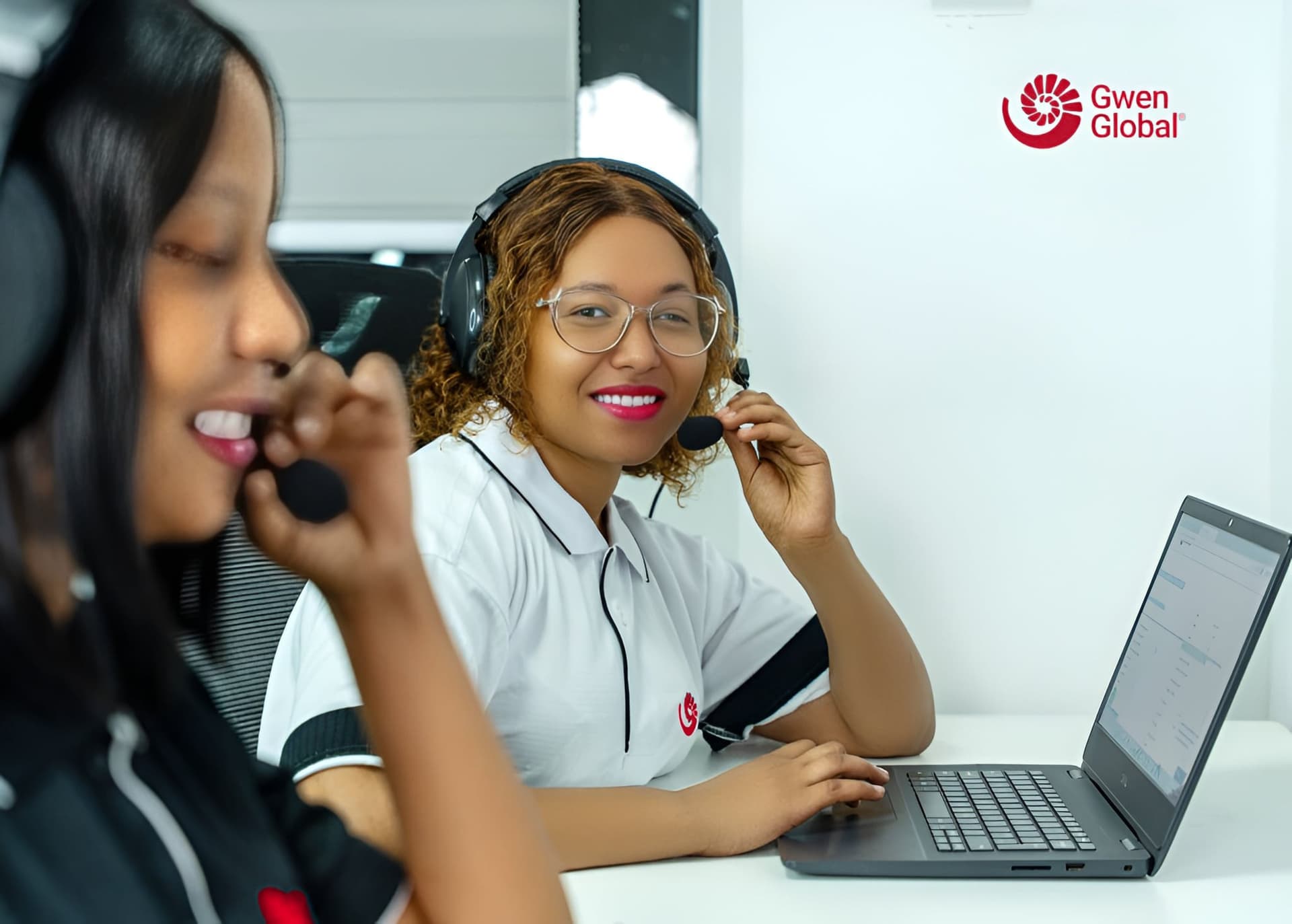 Gwen Global team members assisting clients by phone